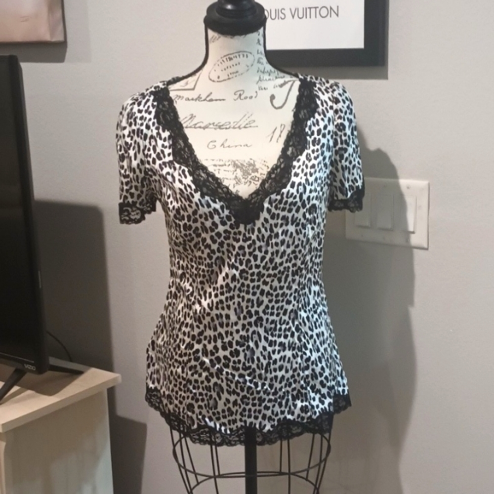 Silk top, lace around the trim. Animal print, look good with a cardigan.